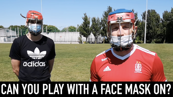 GAA sports players wearing hurling helmets and face masks